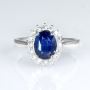 18k gold blue sapphire and diamond ring with a Diana-inspire