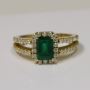 Stunning Emerald Prong Set Halo Ring With Round Diamonds (1.