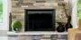 Stunning stone fireplace refacing options by Stone Selex