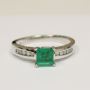 Classic Prong-Set Emerald Ring with Sparkling Diamonds