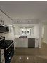 Fully Renovated 2BR/2BA + Bonus Room First-Floor Condo 