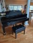 I'm giving away a grand piano and bench, both in perfect con